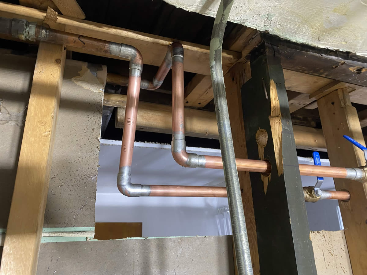 Copper repipe routed through floor joists